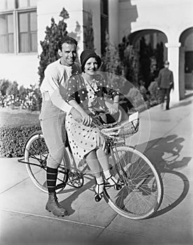 Portrait of couple on bicycle together