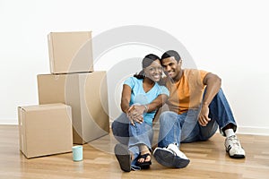Portrait of couple with boxes.