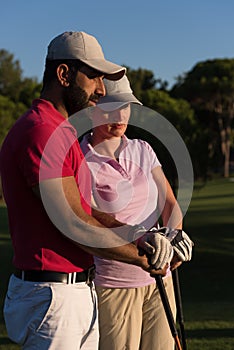 Portrait of couple on golf course