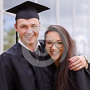 Portrait, couple and happy for university graduation on campus with celebration, success and completion for