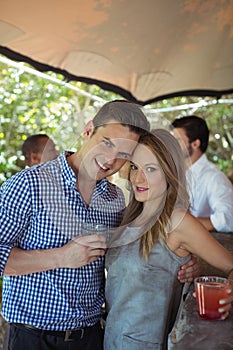 Portrait of couple having a glass of cocktail at counter