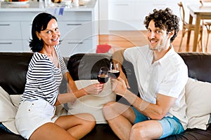 Portrait of a couple having a glass of red wine