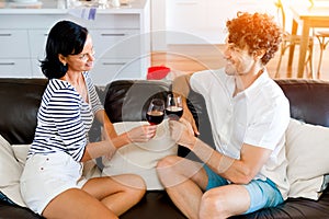 Portrait of a couple having a glass of red wine