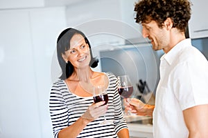 Portrait of a couple having a glass of red wine