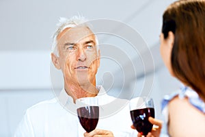 Portrait of a couple having a glass of red wine