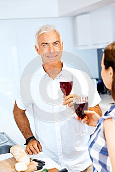 Portrait of a couple having a glass of red wine