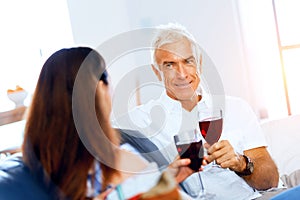 Portrait of a couple having a glass of red wine