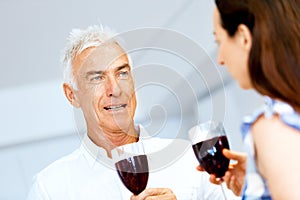 Portrait of a couple having a glass of red wine