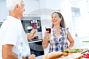 Portrait of a couple having a glass of red wine