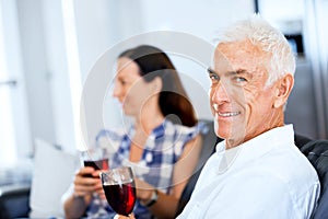 Portrait of a couple having a glass of red wine