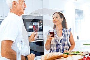 Portrait of a couple having a glass of red wine