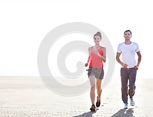 Portrait of couple jogging outside