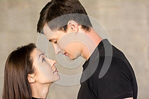 Portrait of couple looking at each other.