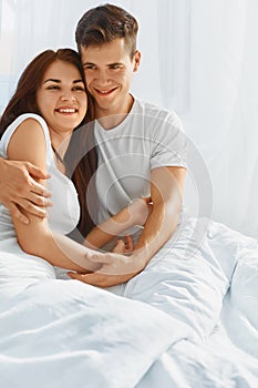 Portrait of couple in love in bed