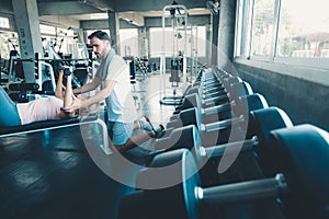 Portrait of Couple Love in Fitness Training With Dumbbell Equipment., Young Couple Caucasian are Working Out and Training Together