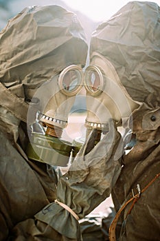 Portrait of couple in love in NBC protective suits and gas masks