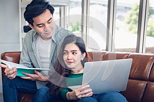 Portrait of Couple Love Relaxing and Enjoying Together in Their Home, Romantic Asian Couple Relax Resting on Comfortable Couch in