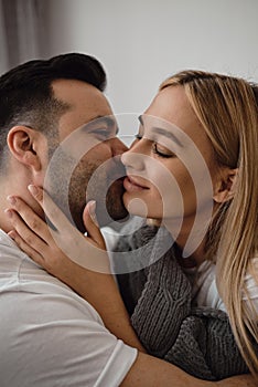 Portrait of a couple, man kissing a woman