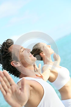 Portrait of a couple relaxing by the sea