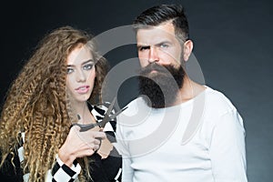 Portrait of couple with scissors