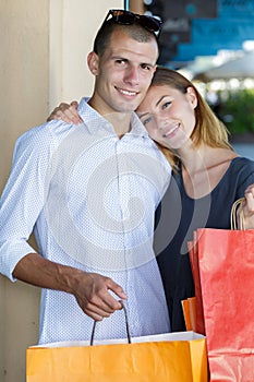 portrait couple with shopping bags