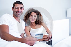 Portrait of couple shopping online