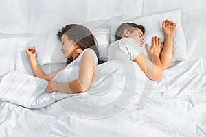 Portrait of couple sleeping in the bed