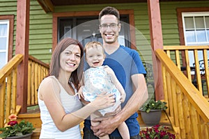 Portrait of couple with their adorable daughter in