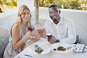 Portrait of couple toasting their wine glasses