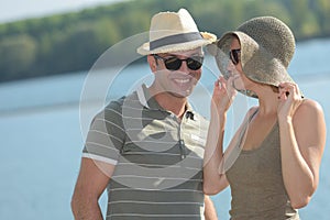 portrait couple wearing sunhats in sumemr weather photo