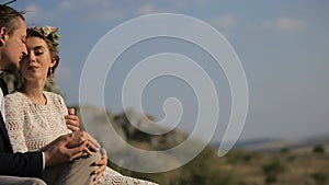 Portrait couples, tenderness love. beautiful young couple on the background meadows