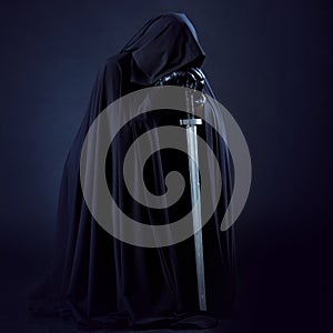 Portrait of a courageous warrior wanderer in a black cloak and sword in hand. photo