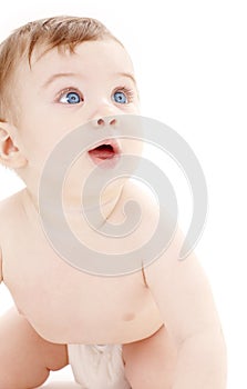 Portrait of crawling baby boy looking up