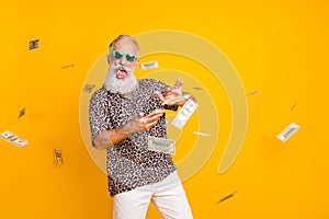 Portrait of crazy funny funky old long bearded man millionaire in eyewear eyeglasses waste money throw banknotes wear photo