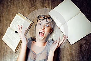 Portrait of crazy student girl in glasses with books and cockroaches, concept of modern education people, lifestyle