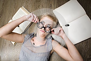 Portrait of crazy student in glasses with books and cockroaches