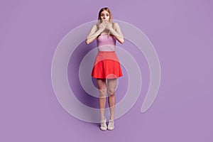 Portrait of crazy voiceless lady crossed hands close mouth wear pink top red short skirt on violet background photo