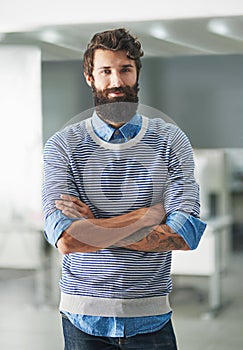 Portrait, creative and business man with arms crossed in startup office for career, job or pride at workplace in Spain