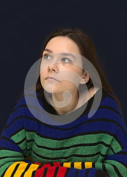 Portrait of a creative young girl looking up