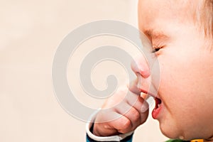 Portrait Of Crying Baby Boy In Home