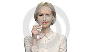 Portrait of crying woman on white background.