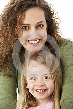 Portrait Of Cuddling Mother And Child photo