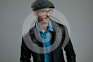 Portrait of curious fashion man looking to side