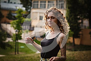 Portrait of curly-haired woman on the street