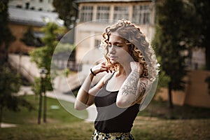 Portrait of curly-haired woman on the street