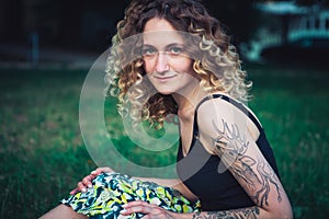 Portrait of curly-haired woman on the street