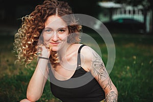 Portrait of curly-haired woman on the street