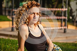 Portrait of curly-haired woman on the street