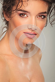 Portrait of curly woman looking at the camera