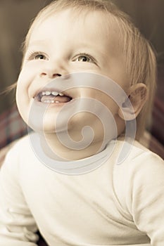 Portrait of a cute 2 year old boy smiling